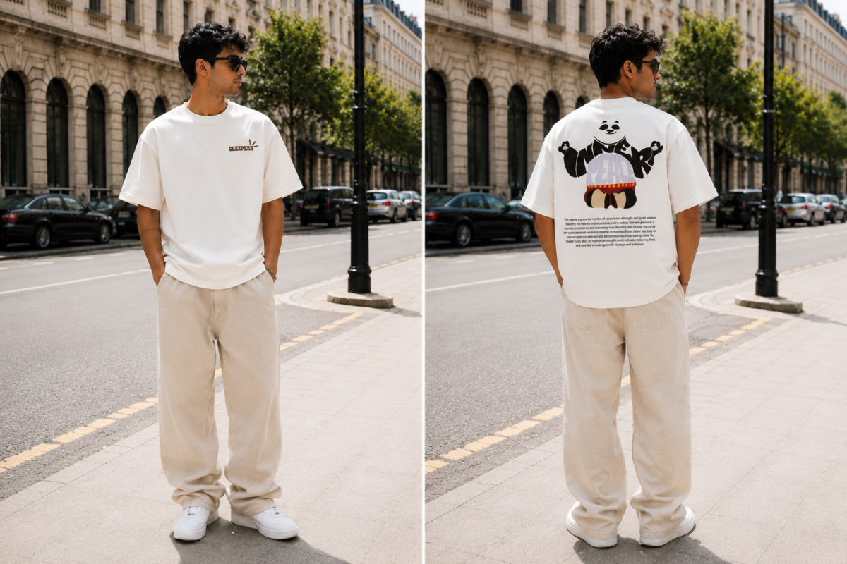 Man styling a white oversized panda graphic T-shirt with beige wide-leg pants for a casual streetwear look